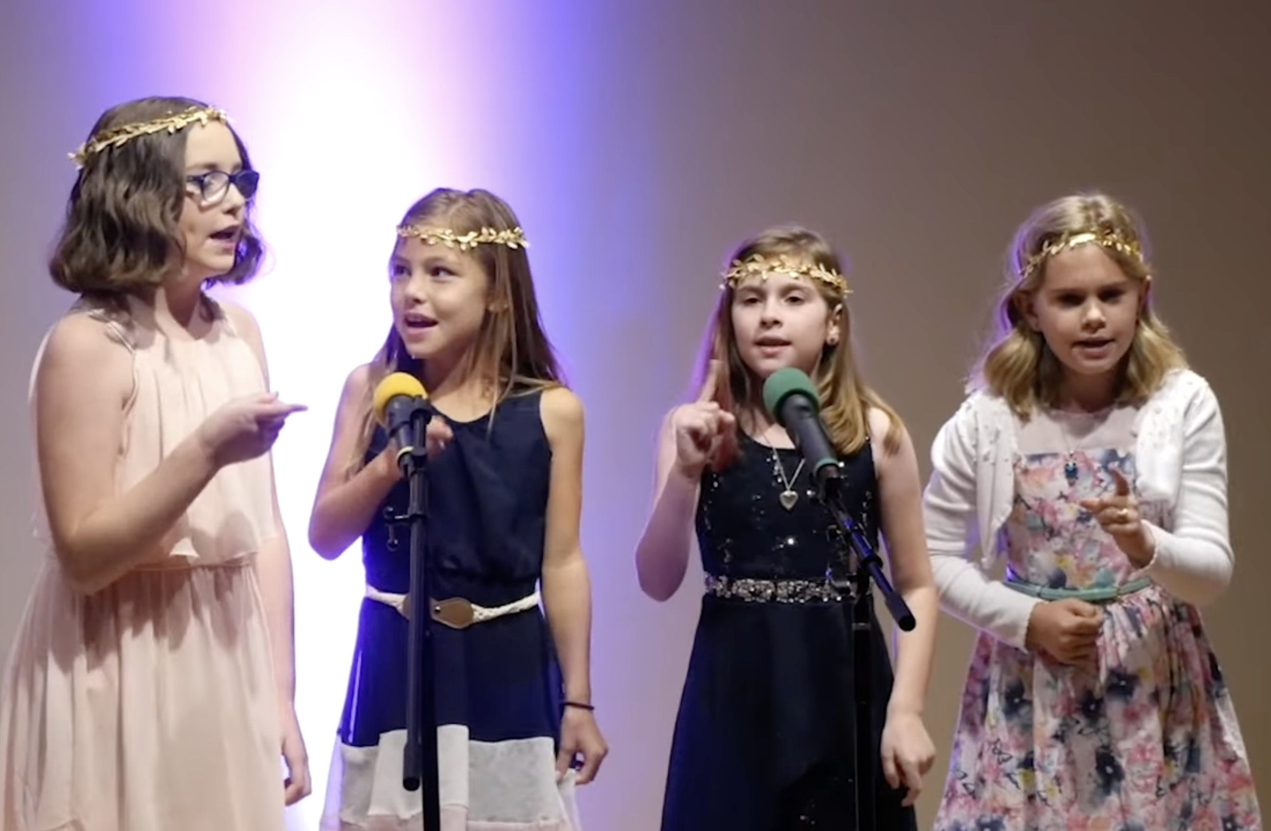 Students sharing a song at a performance.