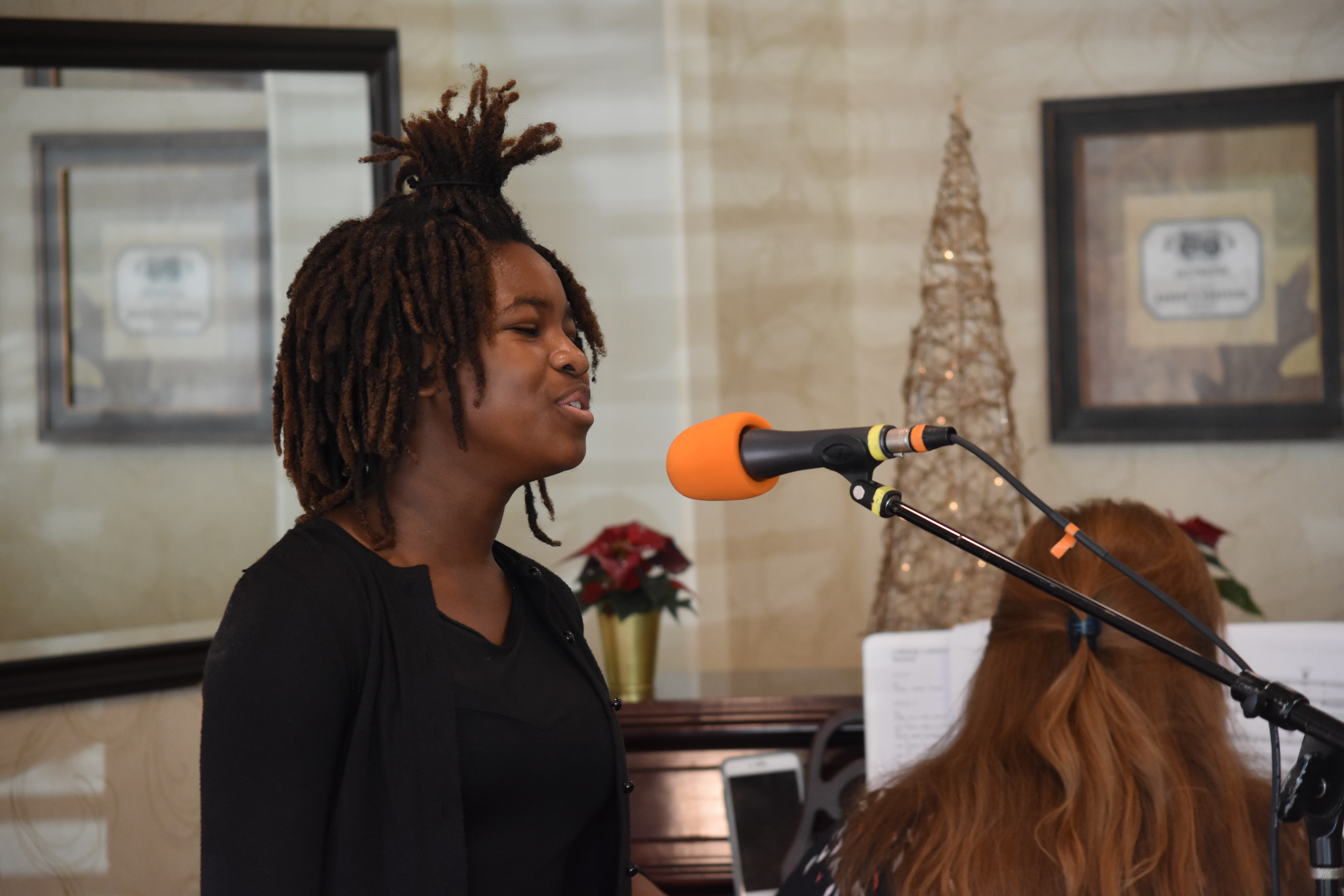 A singer working at a microphone.